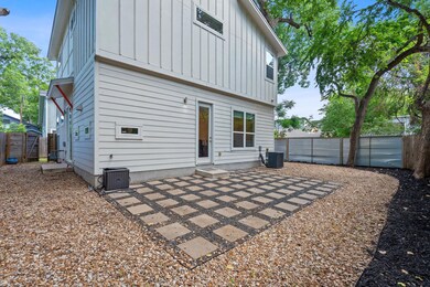 Back of property featuring board and batten sidin