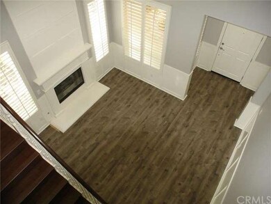 Formal Living room with Laminate wood flooring and