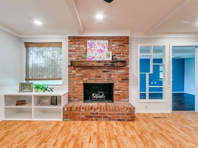 Unfurnished living room featuring ornamental moldi