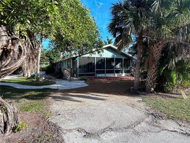 View of front of property featuring a sunroom