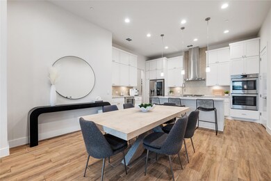 Dining space with light wood-style flooring, rece