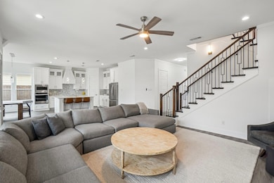 Living room featuring light wood-type flooring, ce