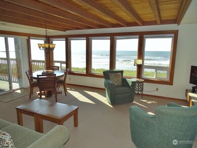Open Living and Dining Room with lots of windows for the Ocean and Jetty views.