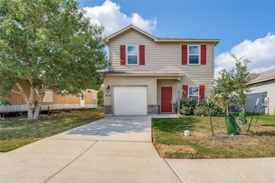 Traditional home with brick siding, driveway, an 