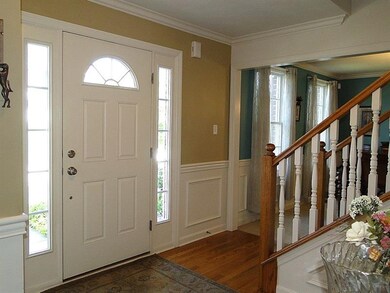Attention to detail as you walk in the front door includes crown molding and wainscoting.