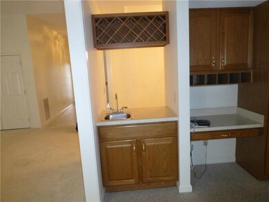 Wet bar from kitchen to dining room.