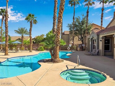 Community pool with a hot tub and a patio