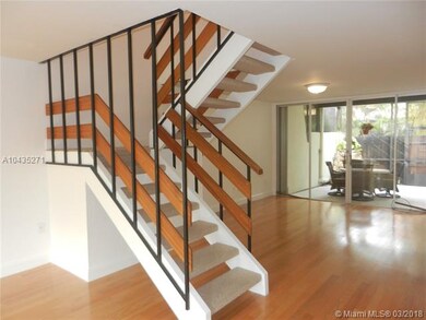 Staircase separating Dining/Living Rooms