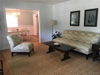 Spacious formal Living Room with walkout bay window, newly refinished hardwoods! Light and bright! Opens to formal dining Room!