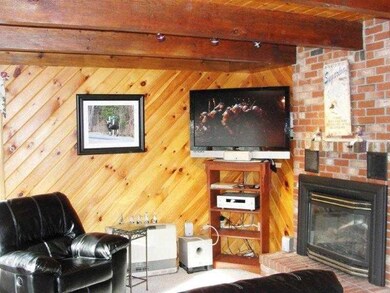 Living Room. Gas Fireplace with...