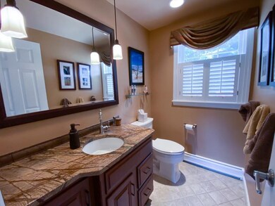 Beautiful updated bathroom with granite countertop