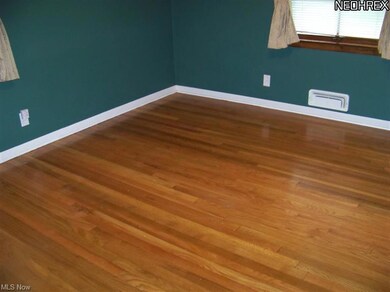 Master bedroom also has gorgeous wood floors -