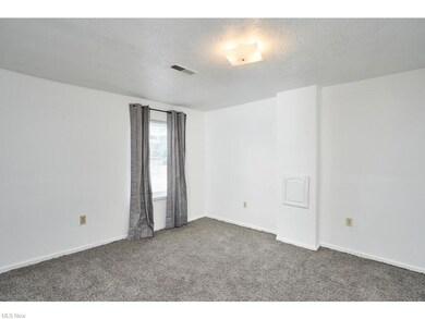 2nd bedroom with new carpeting and window treatmen