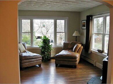 Living Room. The living room has a corner pellet s