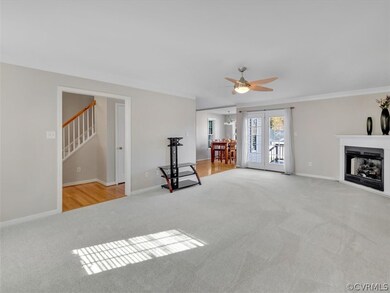 VIEW OF THE FAMILY ROOM LOOKING INTO THE FOYER AND