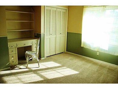 Bedroom. Built in desk and shelves and 2 closets