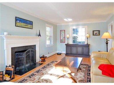 The formal living room has a wood-burning fireplac