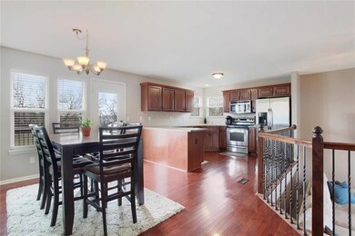 The kitchen/dining combo features wood floors and 