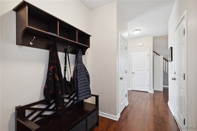 Mudroom with dark hardwood / wood-style flooring