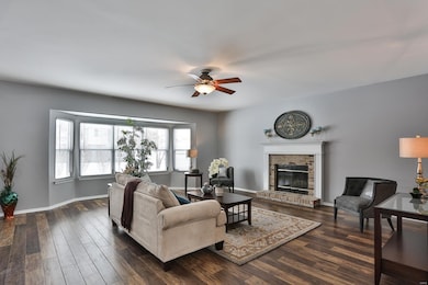 Cozy up to the wood burning brick fireplace with a