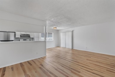 Unfurnished living room featuring light wood-styl