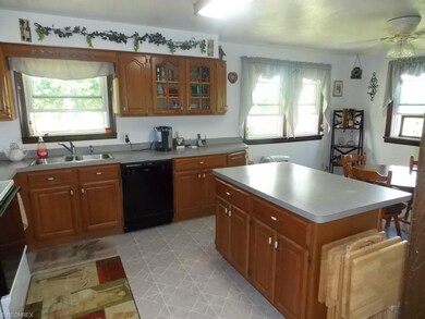 Generously-sized, eat-in, kitchen has lots of natu