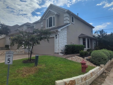 View of side of home with stone siding, stucco si