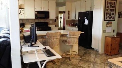 Kitchen features lots of cabinet space, perfect fo