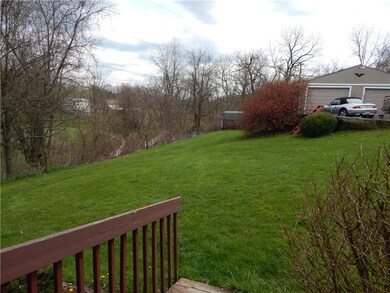 Generous sized side yard below the driveway and ga