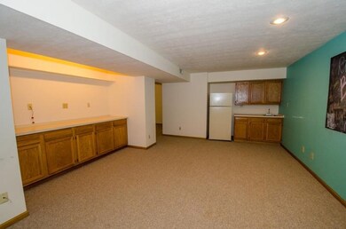 Contains a kitchenette with a buffet serving count