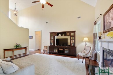 From the foyer, follow the hardwood floors to the