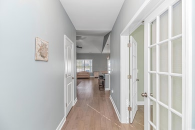 Hallway featuring light hardwood / wood-style floo