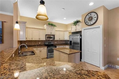 Kitchen featuring tasteful backsplash, stainless s