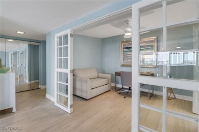 Office space featuring wood finished floors and a ceiling fan