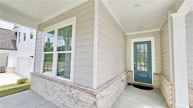 Doorway to property featuring a garage