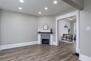 Hardwood floored living room with a fireplace