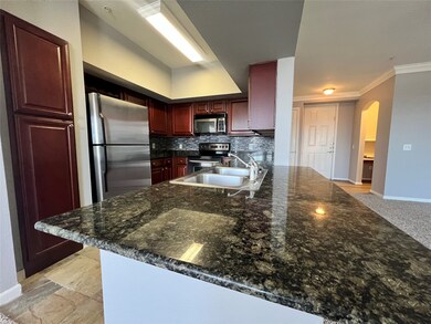 The kitchen includes slate floors, granite counter