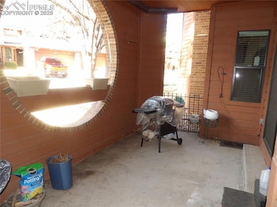 View of patio featuring a grill