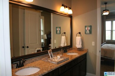 Double vanity with granite counters.