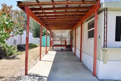 View of patio with a storage shed
