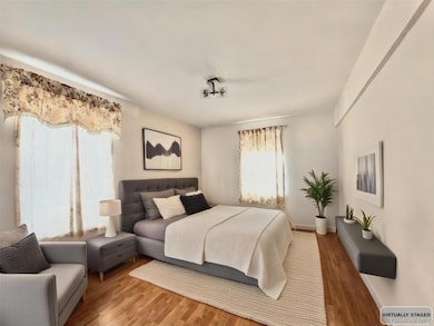 Bedroom featuring wood finished floors