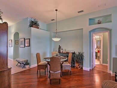 NICE DINING AREA WITH PLENTY OF PLANT SHELVES TOO!