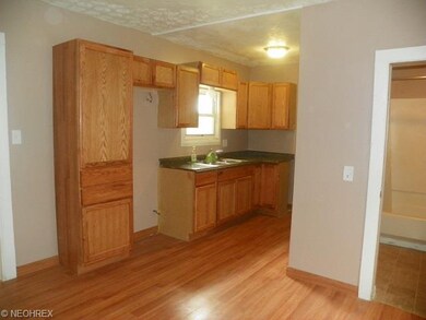 Large new oak kitchen with laminate flooring  new 
