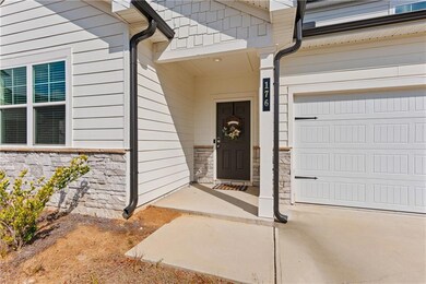 Covered front entry welcomes guests with understated sophistication.