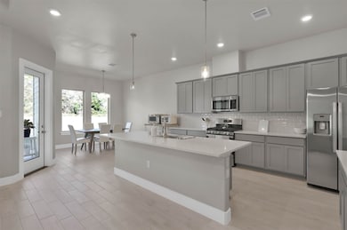 Kitchen & breakfast area. Notice the large island