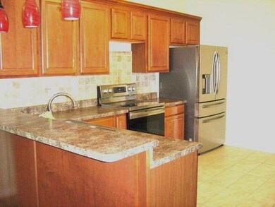 Kitchen featuring light tile patterned flooring, k