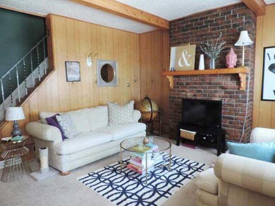 Living Room. Faux brick dec fireplace