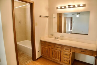 Primary Bathroom with Vanity and Tub