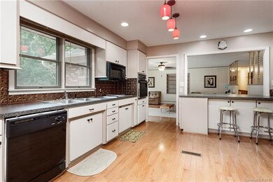 Large, open kitchen with eat-in breakfast bar