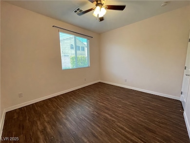 Unfurnished room featuring dark wood finished floo